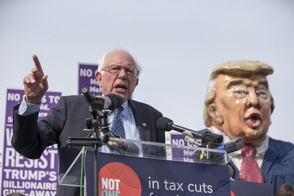 United States Senator Bernie Sanders  speaks during a rally led by United States congressional Democrats against  President Donald J. Trump's proposed tax plan outside the U.S. Capitol in Washington, D.C. in 2017
