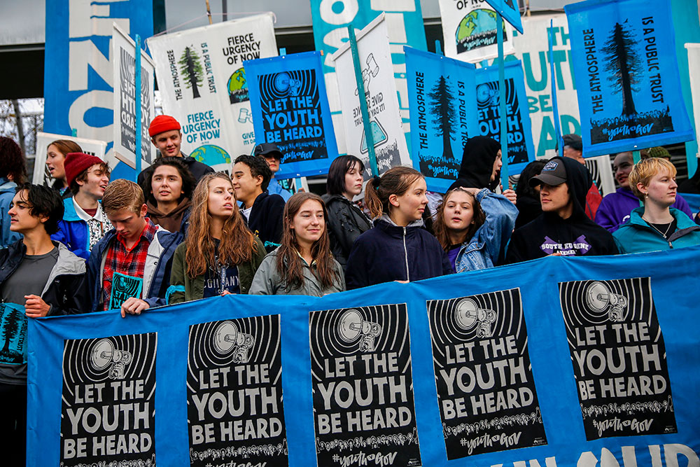 Young people demonstrate in support of the youth plaintiffs in the climate change lawsuit Juliana v. U.S. in front of the Wayne L. Morse Courthouse on October 29 in Eugene, Oregon