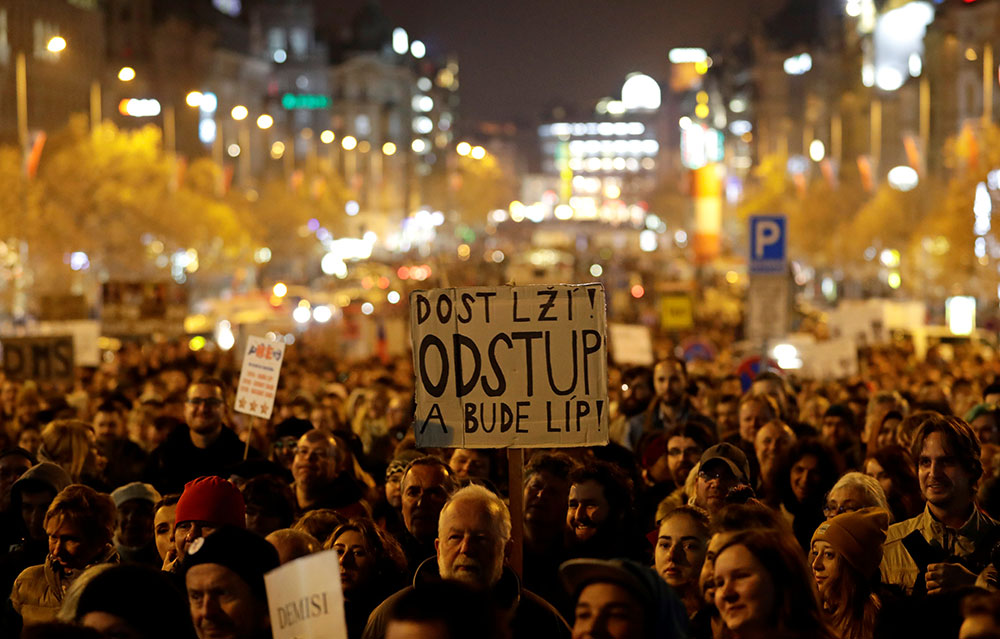 A sign at a 2018 rally in Prague protesting Czech Prime Minister Andrej Babiš reads, “Enough lies, resign and it will be better”
