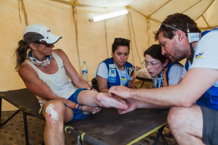 Amy Palmiero-Winters has doctors look at her leg after she finished the Marathon des Sables, a 140-mile, six day ultramarathon through the Sahara Desert in Morocco, April 12, 2019.