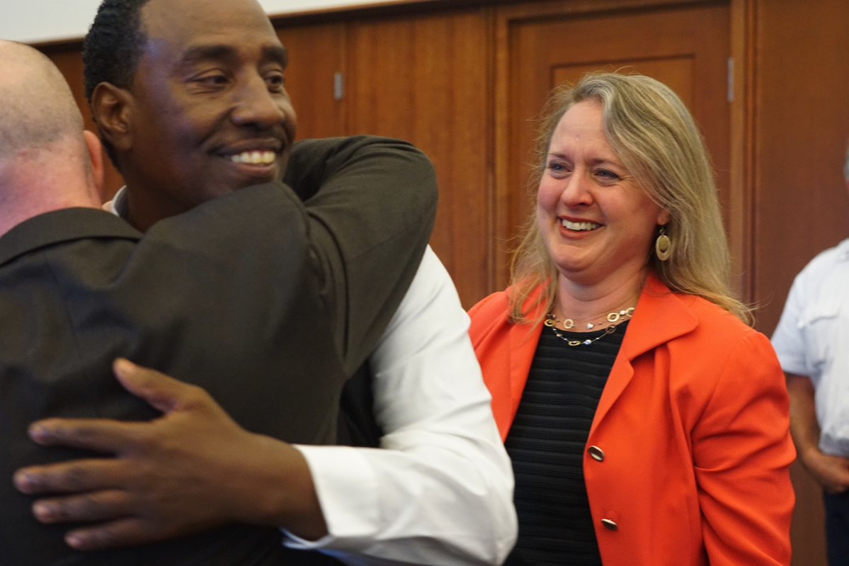 Darrell Jones celebrates with his attorneys after being found not-guilty of a 1985 murder after a judge vacated his earlier conviction. To his right is Lisa Kavanaugh, director of the state's Innocence Program