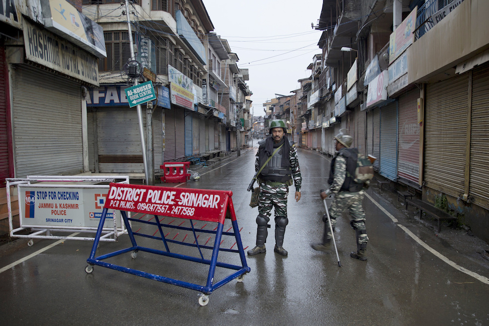 Indian paramilitary soldiers stand guard during lockdown in Srinagar, Indian-controlled Kashmir, in August 2019