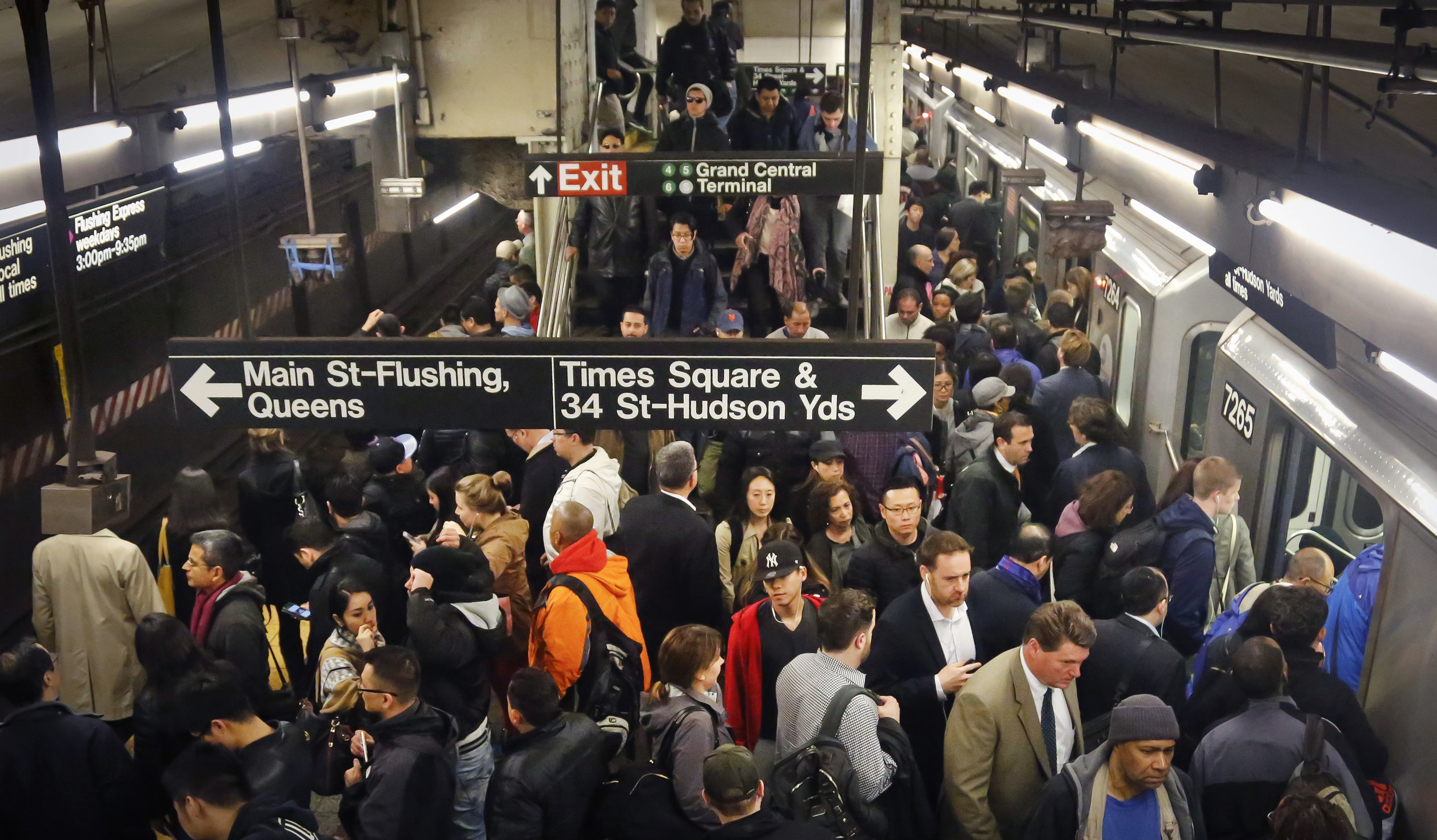 Commuters crowd a Grand Central subway station platform in New York in 2016