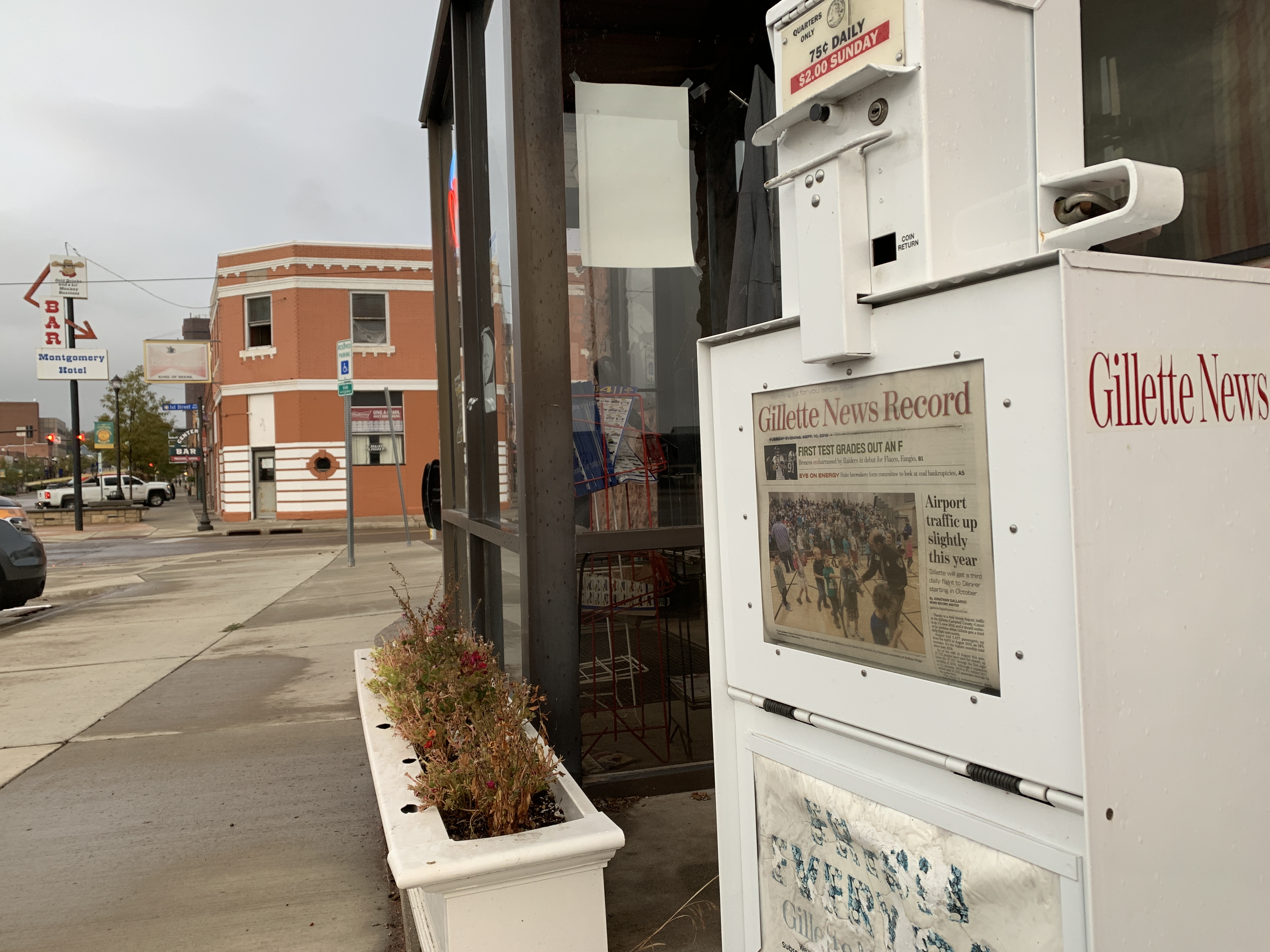 A newspaper box sits outside Lula Belle’s Cafe in downtown Gillette, Wyoming. The box containing copies of the local paper, the Gillette News Record, is the only vending machine left standing outside the popular breakfast eatery