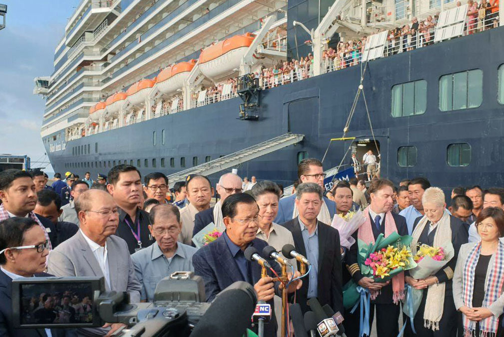 Cambodian Prime Minister Hun Sen makes an address to passengers who disembarked from the Westerdam cruise ship at the port of Sihanoukville in February 2020; the ship had previously been turned away from at least five ports in Asia over fears of coronavirus. Cambodia is one of several countries where assaults to the democratic process are underway under the guise of measures being necessary to combat COVID-19