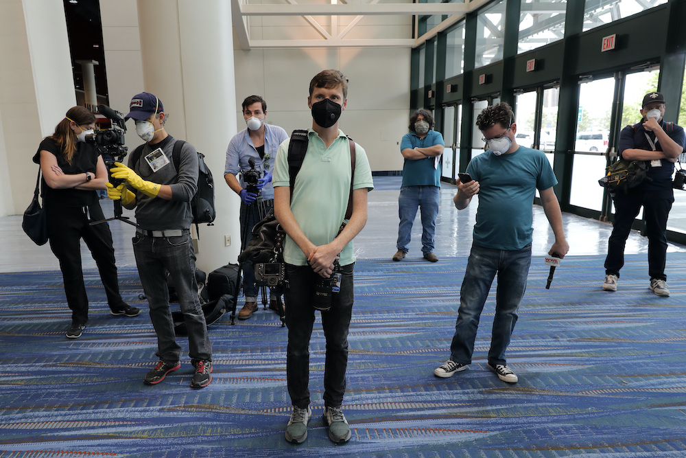 Journalists wearing personal protective equipment assemble in April 2020 for a tour of a temporary hospital that has been set up in the Ernest N. Morial Convention Center in New Orleans as overflow for local hospitals that are reaching capacity due to the COVID-19 pandemic