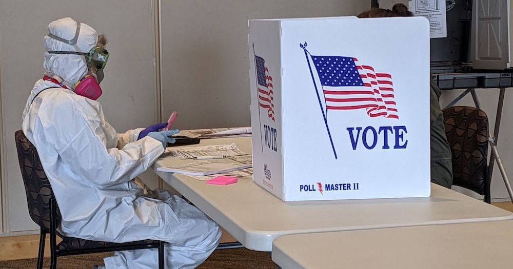Wisconsin primary election poll worker wears full hazmat gear