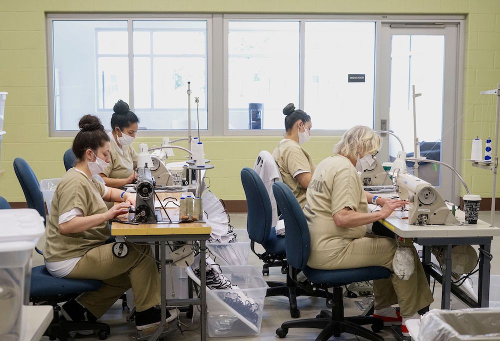 Inmates sew protective masks at Las Colinas Women's Detention Facility in Santee, California, on  April 22, 2020. The Marshall Project partnered with the Associated Press to track coronavirus cases in prisons