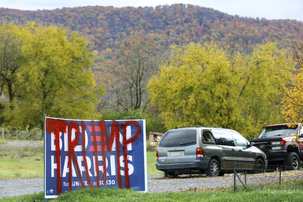 A Biden-Harris sign is spray-painted with the word "Trump" near Centre Hall, Pennsylvania on October 24, 2020