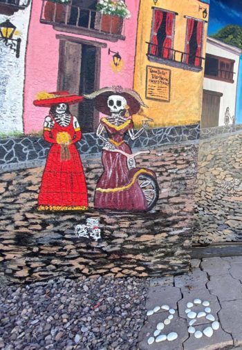Day of the Dead street art with No. 28 in the shell countdown.