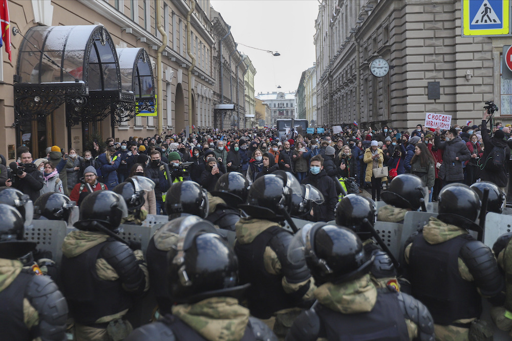 Members of the Russian National Guard block the street during a protest against the detention of Alexei Navalny in St. Petersburg on Jan. 31
