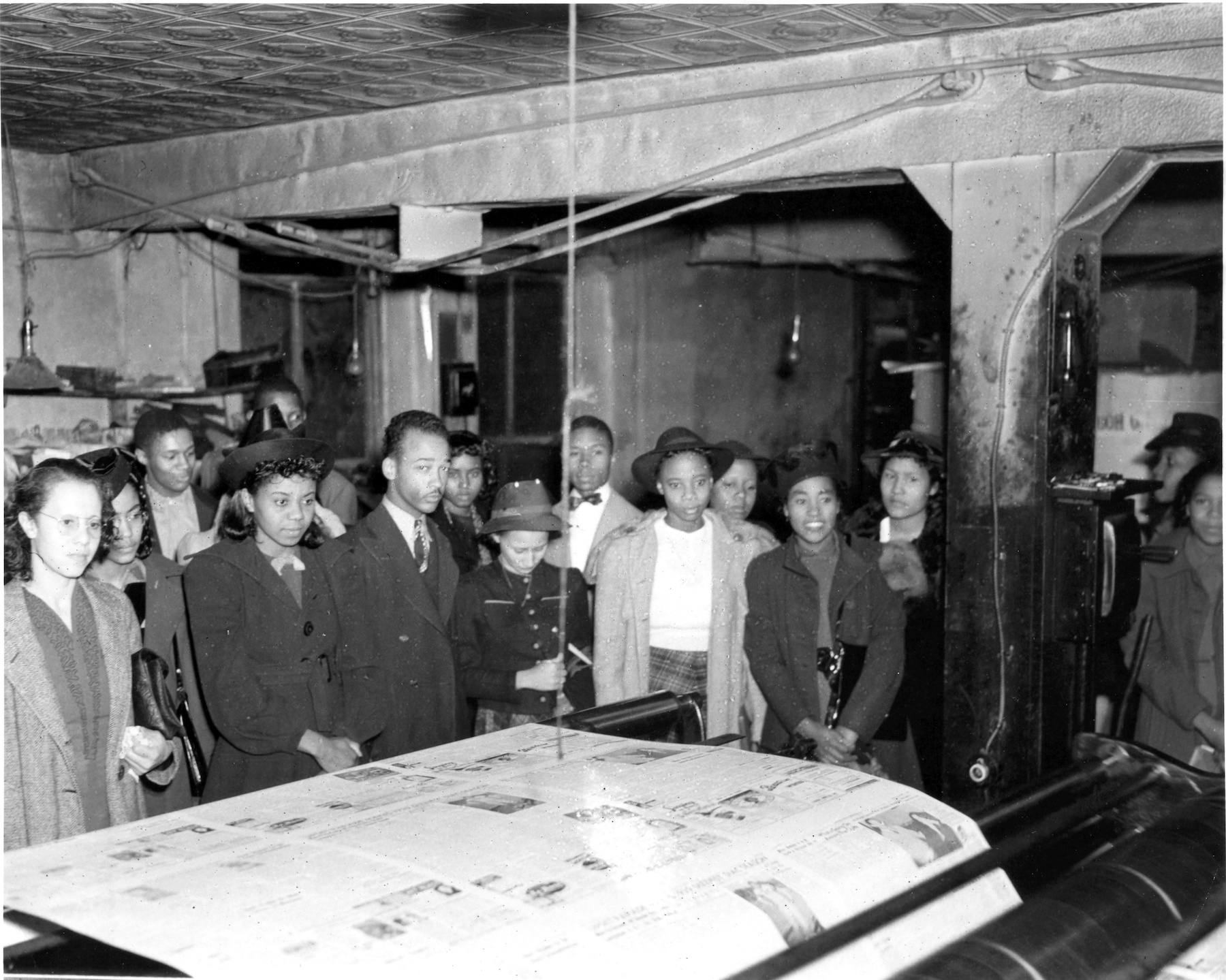 In this undated 1940s photo, students tour the printing plant of the Atlanta Daily World, Atlanta's oldest Black newspaper. During the Jim Crow era, Black newspapers played an important role in challenging white supremacy