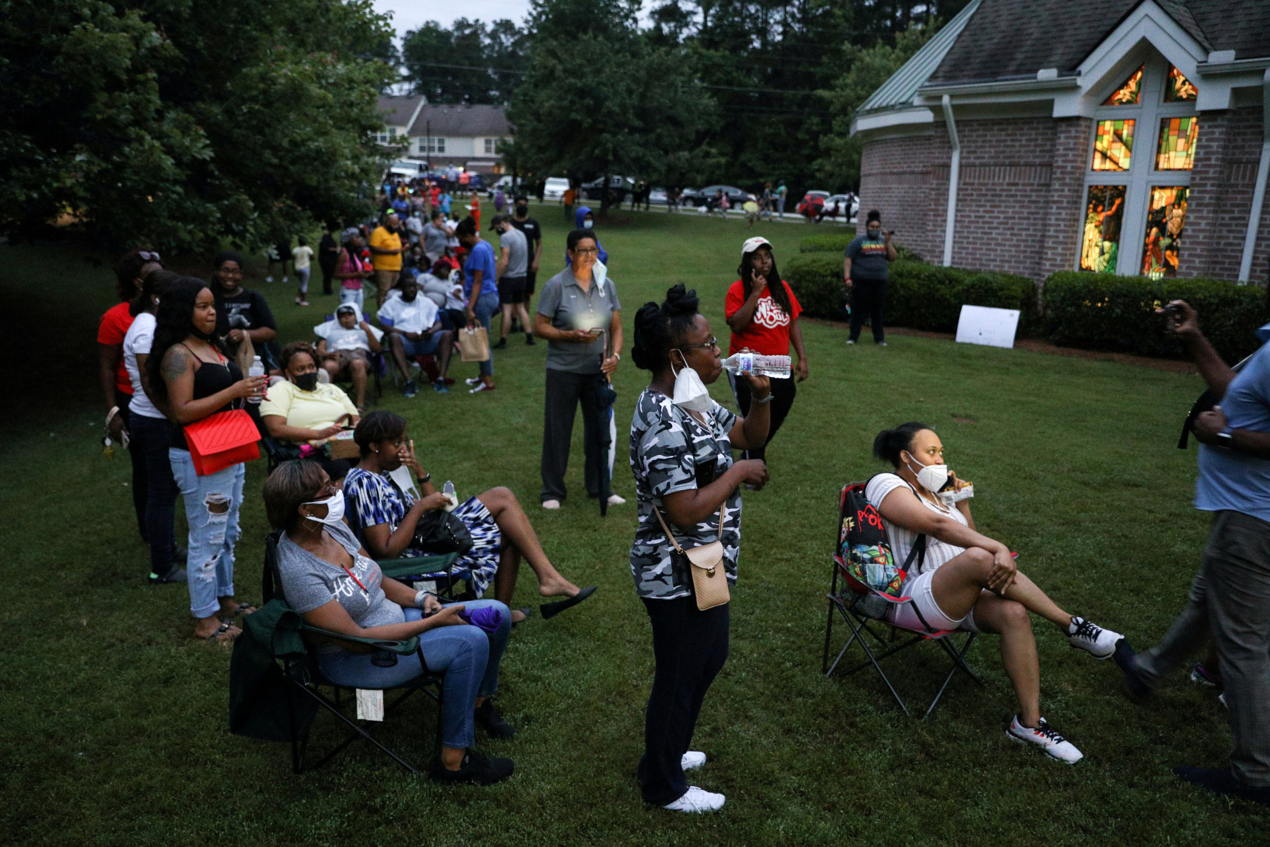 Voters line up at Christian City, an assisted living home, to cast their ballots after Democratic and Republican primaries were delayed due to coronavirus restrictions in Union City, Georgia in June 2020