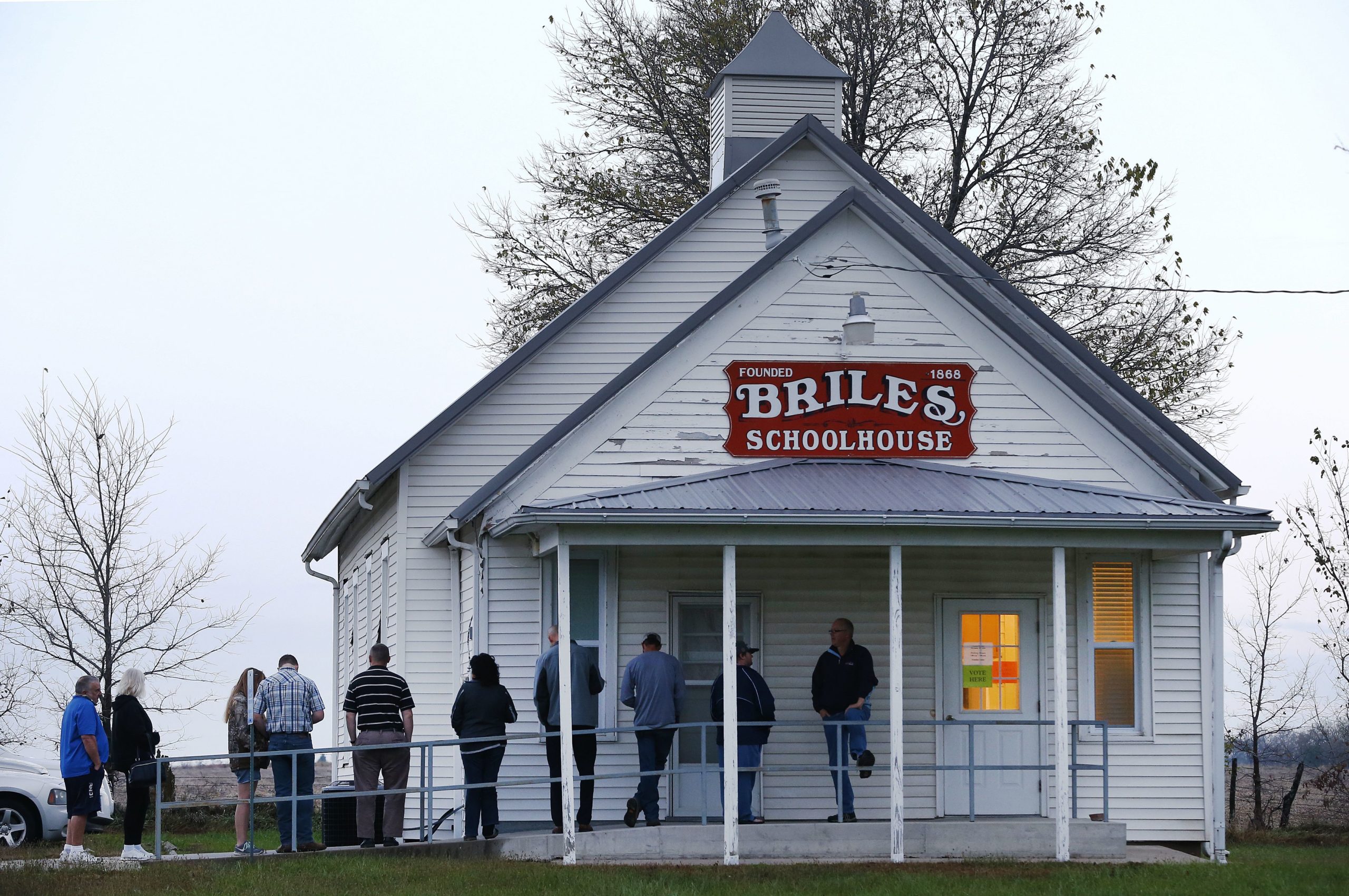 Voters wait in line outside before the polls open for the 2016 U.S. presidential election at Briles Schoolhouse in Peoria Township near Ottawa, Kansas. Conducting polls through new methods, like text or email, can help pollsters reach underrepresented rural participants 