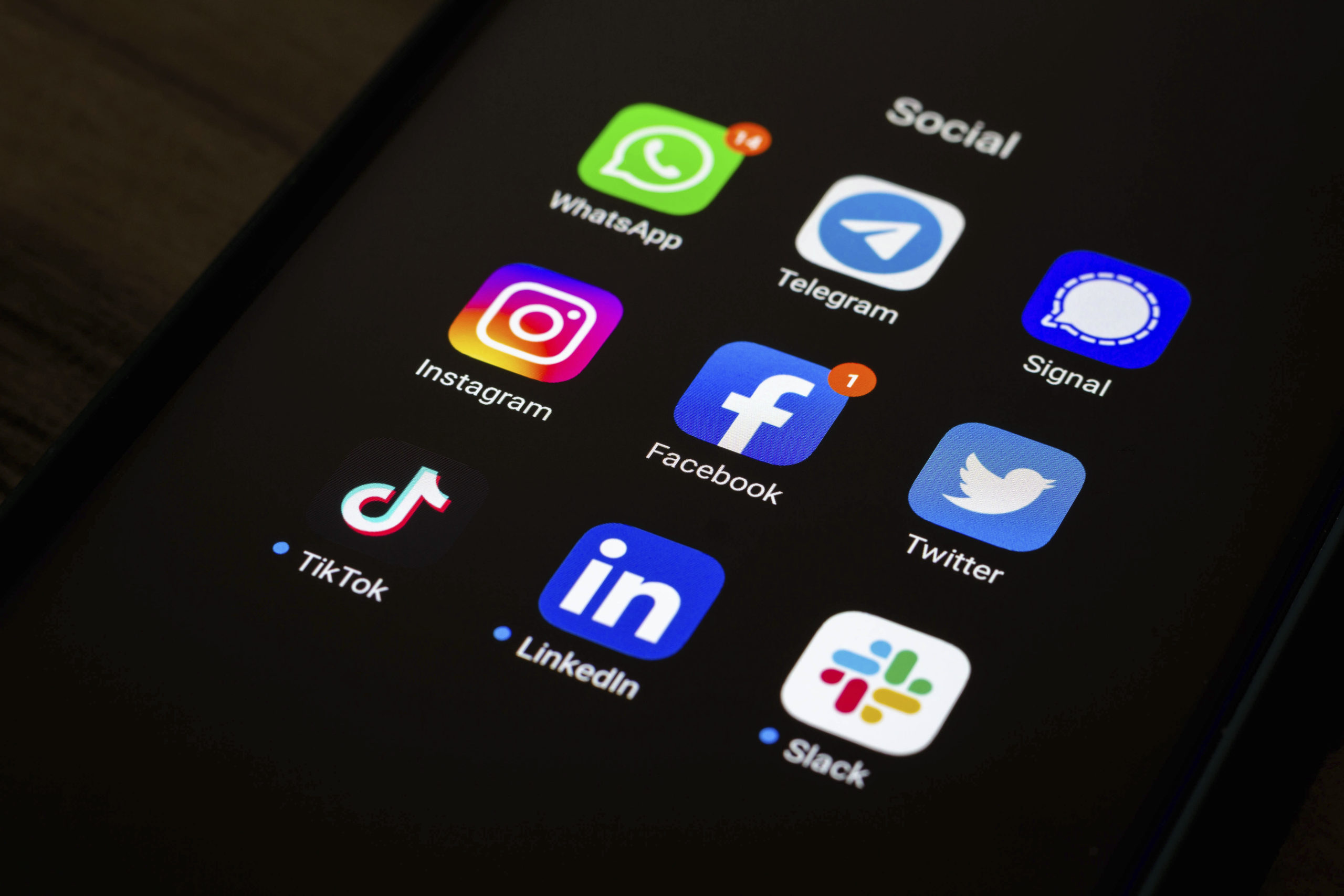 The Whatsapp, Telegram, Signal, Instagram, Facebook, Twitter, Tik Tok, LinkedIn and Slack app and logos seen displayed on a smartphone. As few journalism institutions offer job stability, some journalists have honed their online brand
