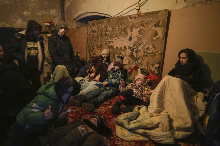 People settle in a bomb shelter in Mariupol, Ukraine, Sunday, March 6, 2022