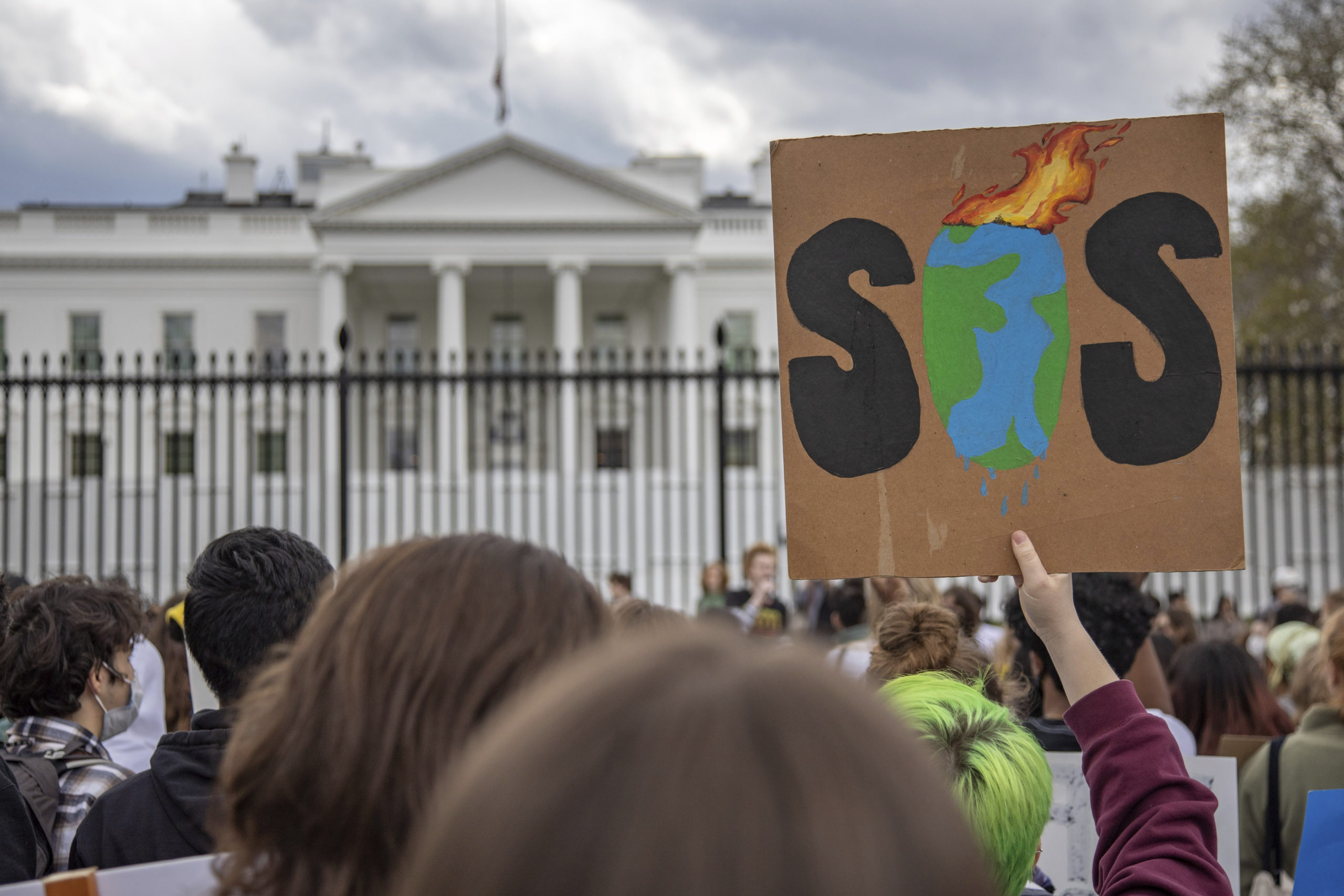 Climate activists gather at the White House for a rally and march to the U.S. Capitol on March 25, 2022 as they take part in a global strike demanding action from the Biden administration on climate change (Photo by Bryan Olin Dozier/NurPhoto via AP)
