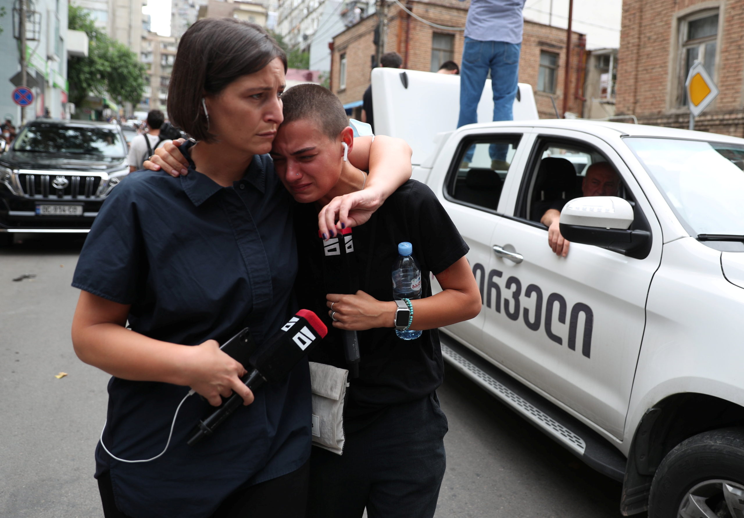 Mourners react during a funeral of journalist Alexander Lashkarava in Tbilisi, Georgia, on  July 13, 2021. Lashkarava was found dead at his home several days after he was beaten during attacks on LGBT+ activists in Tbilisi 