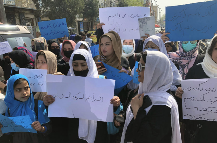 Afghan women hold signs of protest during a demonstration in Kabul on March 26, after Taliban rulers refused to allow dozens of women to board flights because they were traveling without a male guardian. The work of Rukhshana Media, which centers on the experiences of women, has become even more important since the Taliban seized power last August