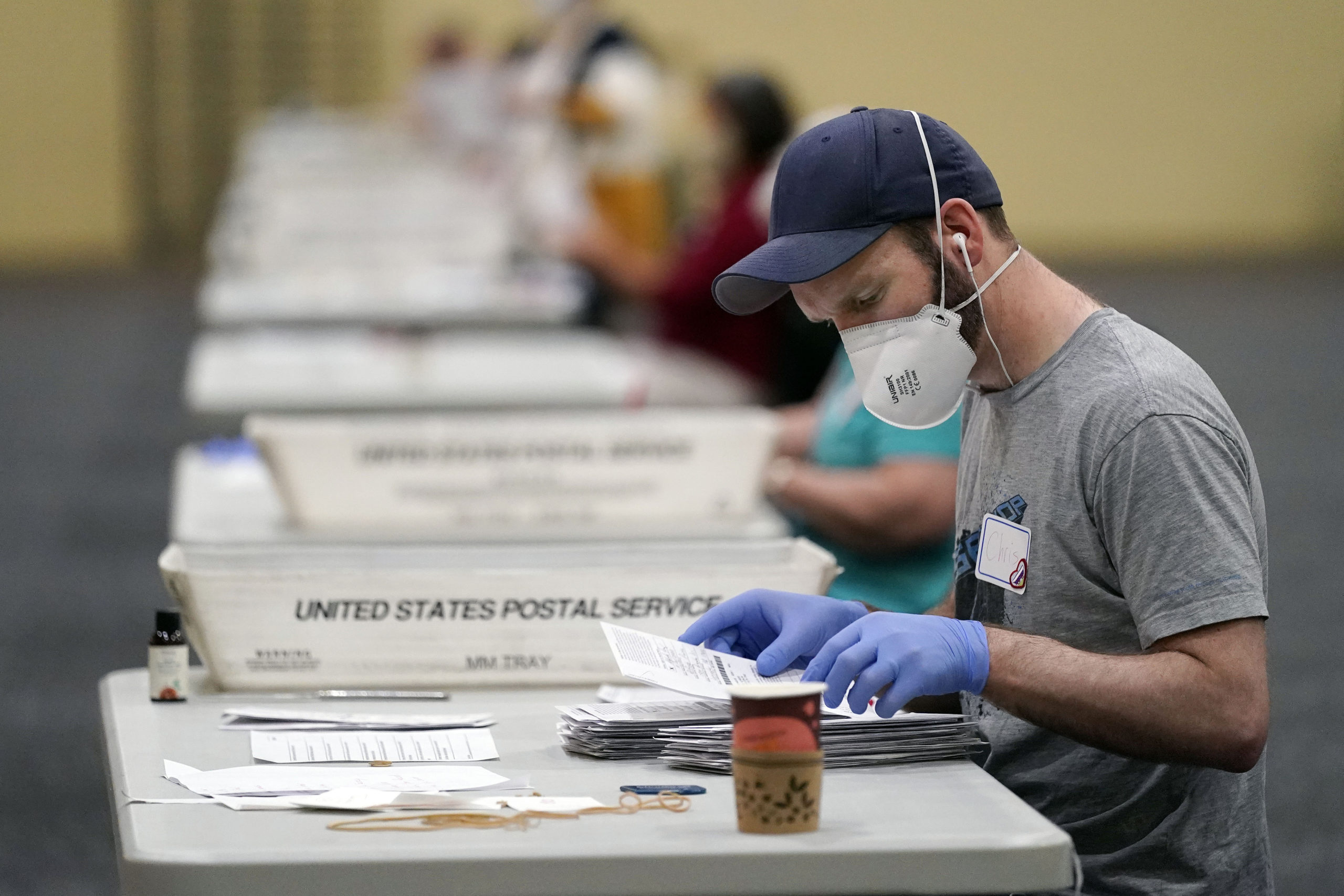 Workers prepare mail-in ballots for counting, Nov. 4, 2020, at the convention center in Lancaster, Pa. outlets developing democracy beats are delving into the laws that govern elections and the people who administer them — areas that traditionally received little in-depth coverage when compared to the horserace