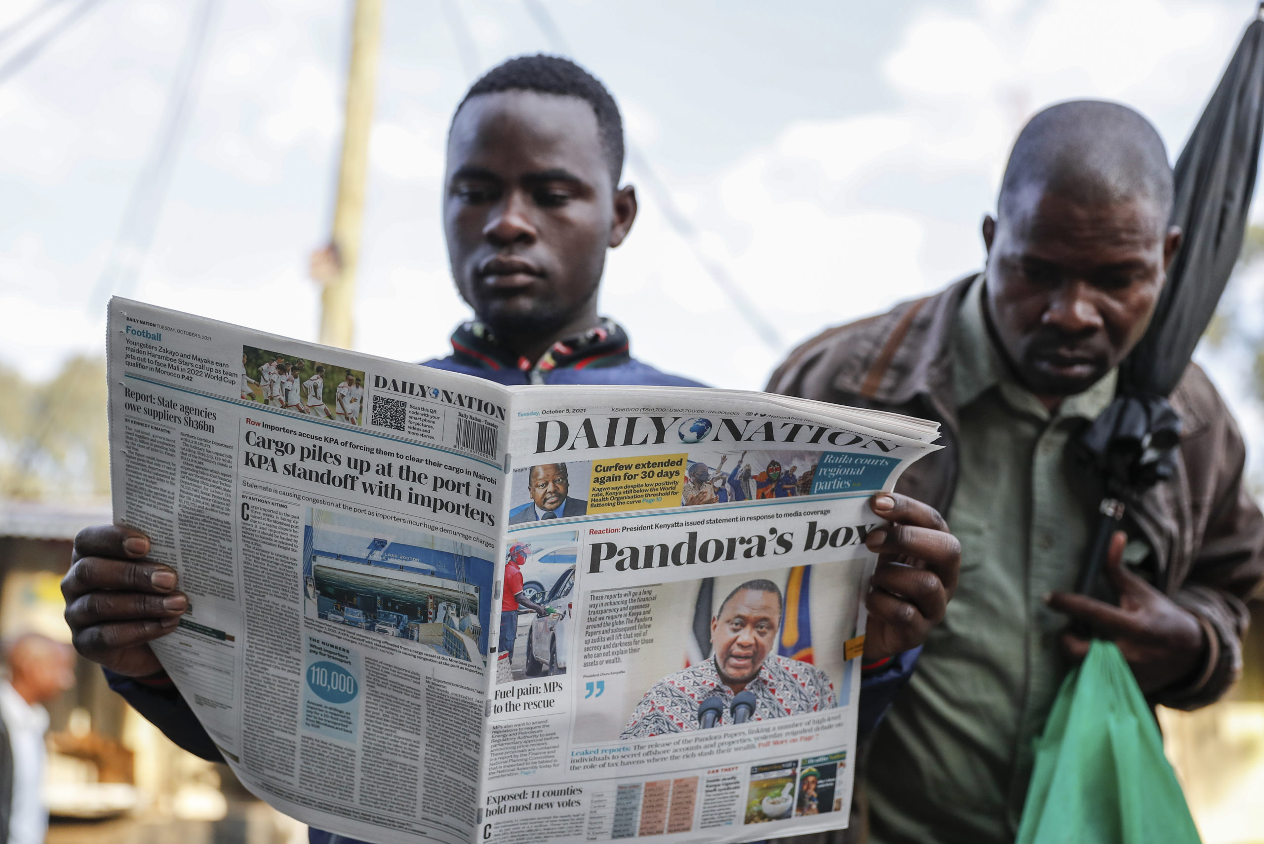 Locals read the morning newspapers reporting a statement issued by President Uhuru Kenyatta after the Pandora Papers revealed that he is among more than 330 current and former politicians identified as beneficiaries of secret financial accounts