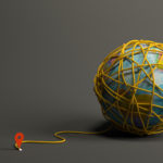 On a grey background, on the righthand side of the frame, a globe wrapped in yellow string trails down to the left side of the frame, where the trail of yarn ends at a location pinpoint