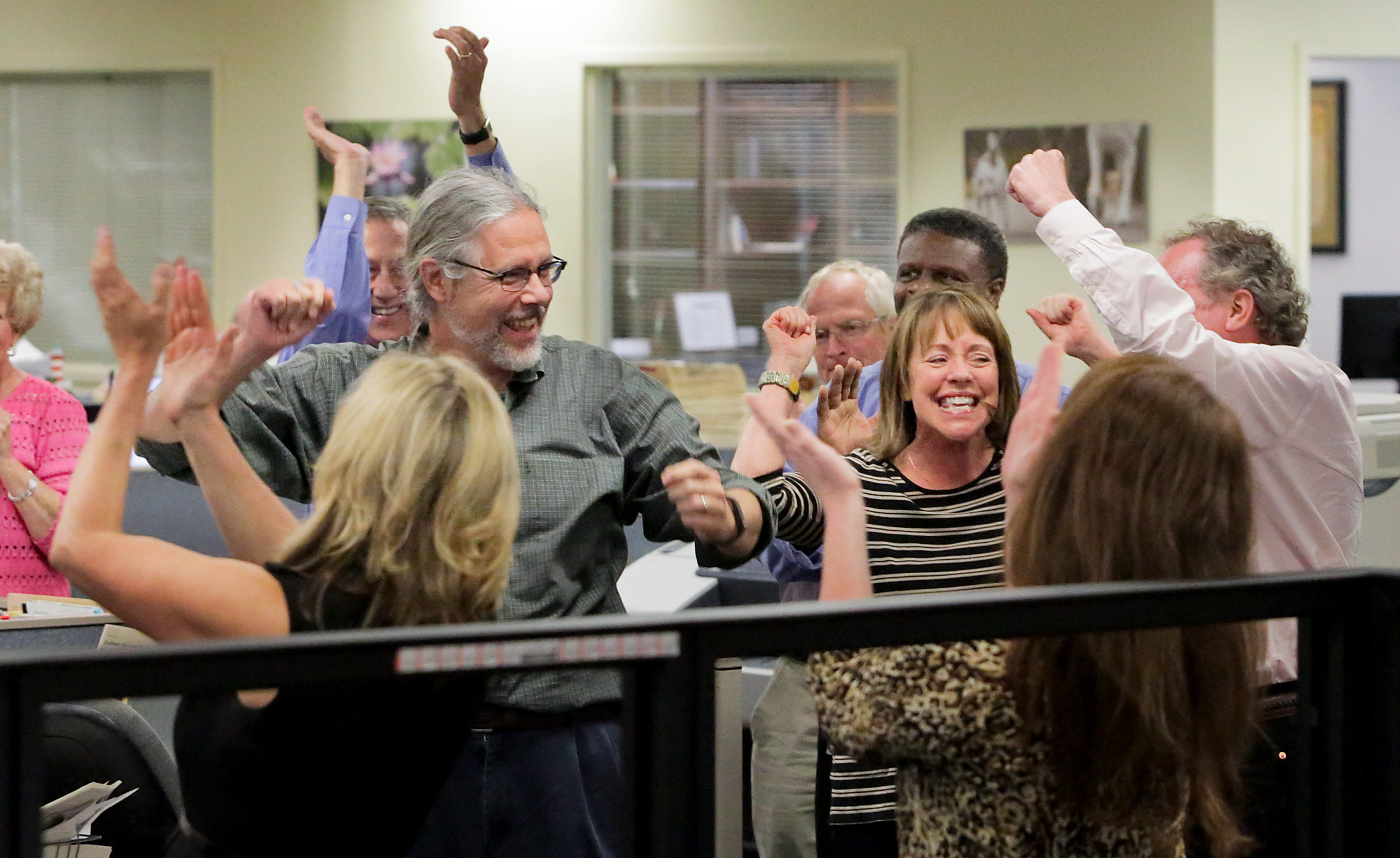 The Post and Courier staff cheers after the Pulitzer prize announcement, April 2015. Independent, civic-driven dailies, like The Post and Courier, show the life — and potential digital transformation — of many remaining formerly “print” operations