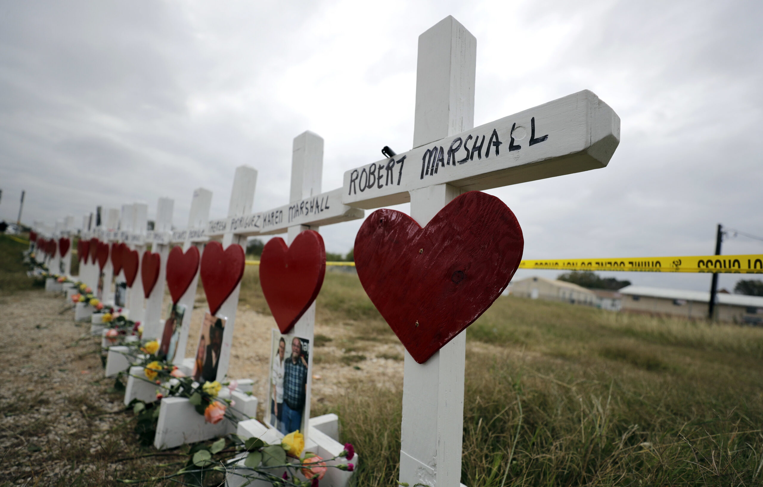 Crosses showing shooting victims names stand near the First Baptist Church in Sutherland Springs, Texas. A man opened fire inside the church in the small South Texas community in 2017, killing more than two dozen and injuring others 