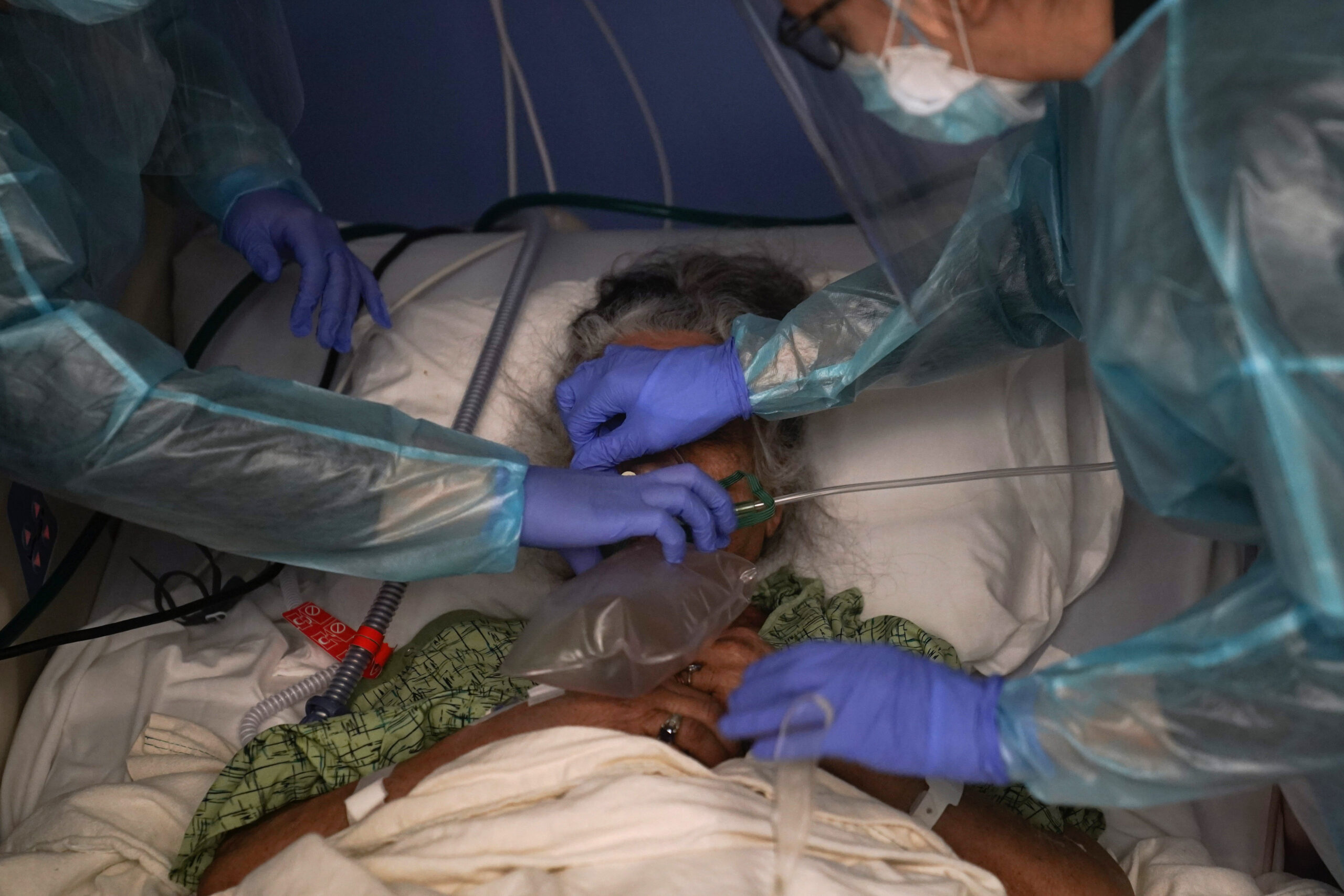 Two nurses put a ventilator on a patient in a Covid unit at St. Joseph Hospital in Orange, Calif. Jan. 2021. California's Covid emergency declaration ended on  Feb. 28, 2023, and the national emergency declaration ended on April 11