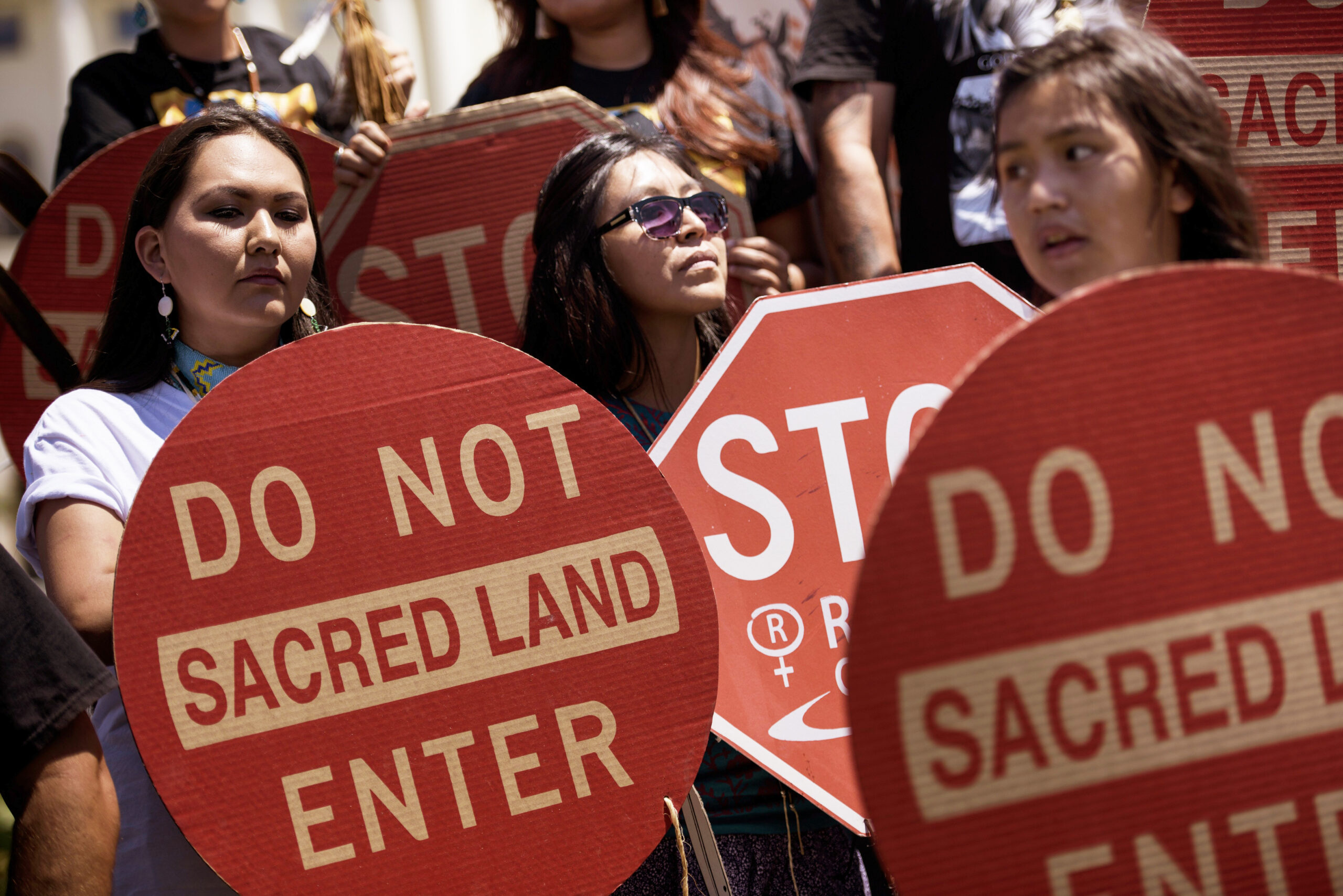 Members of the San Carlos Apache Nation protest a bill that would turn over parts of the Oak Flat that are sacred to the Apache to a foreign copper mining company